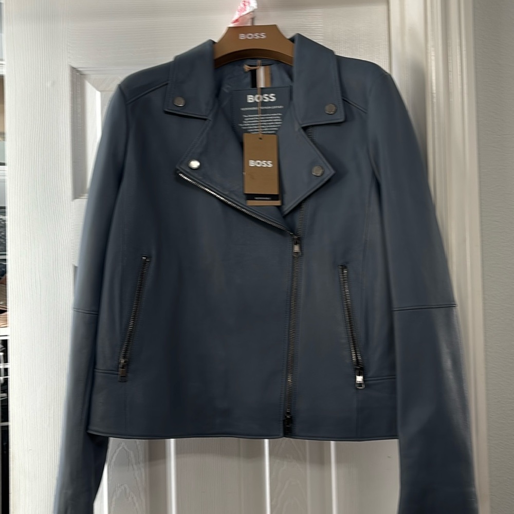 Boss blue leather motorcycle jacket with tags attached.